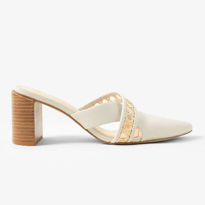Off-white heeled mules with a pointed toe and a straw weaved pattern, featuring a chunky wooden heel on a plain white background.