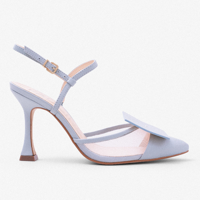 Light blue high-heeled sandal with a delicate strap & pointed toe with an adjustable ankle strap, featuring a decorative bow on the vamp.